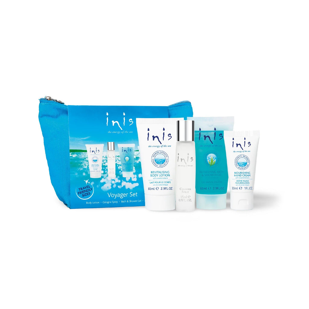 Inis Voyager Gift Set with blue zip cosmetic bag and four travel-size products: body lotion, cologne spray, shower gel and hand cream, on white background