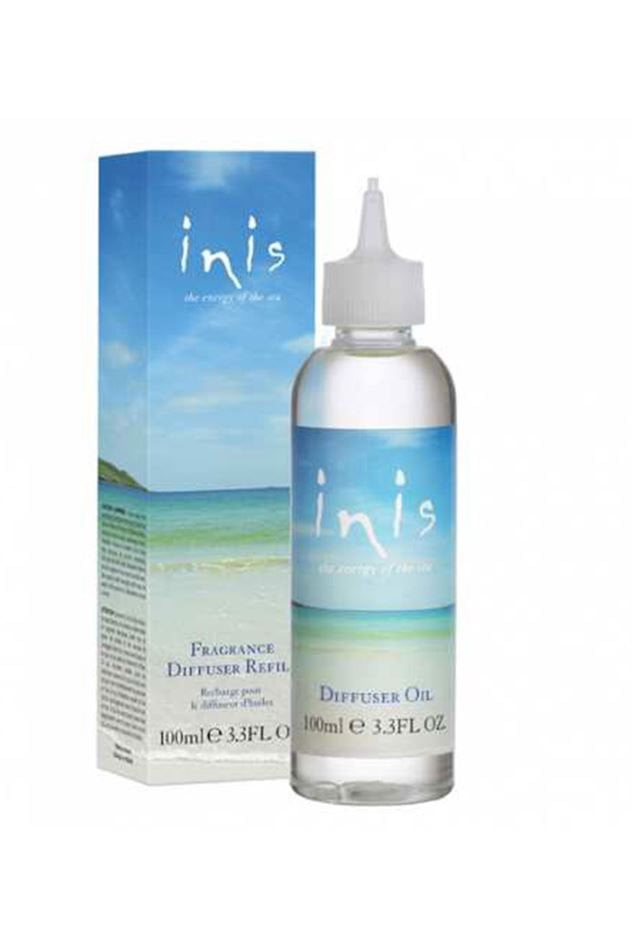 Inis Fragrance Diffuser Refill 100ml clear oil bottle with nozzle tip, next to branded box with seascape design